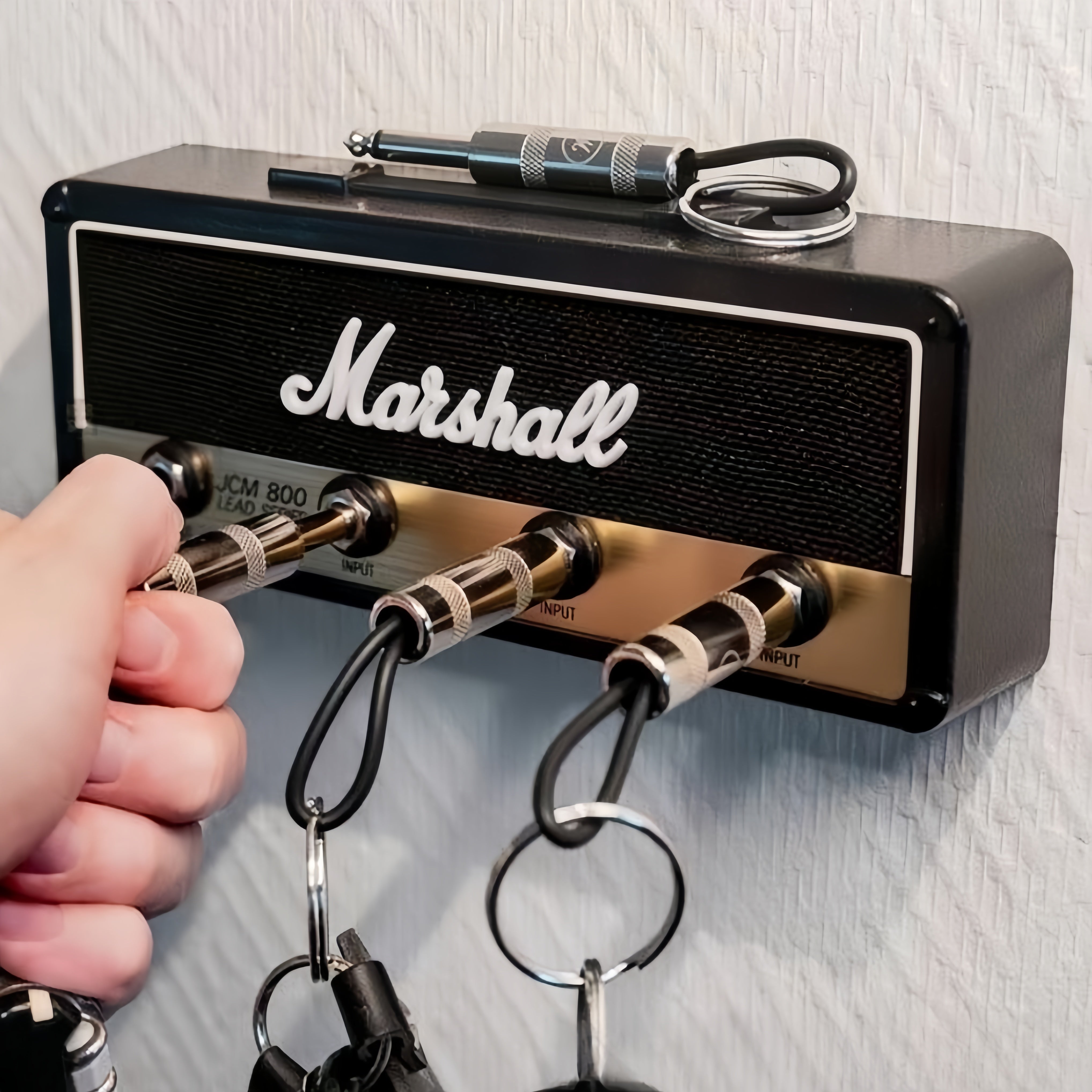 Fender Jack Rack™ | Wandhalterung + 4 AMP Schlüsselanhänger